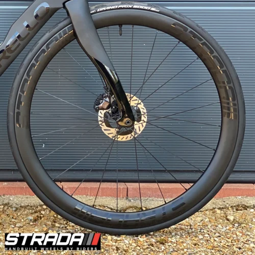 an image of Strada PAD Carbon 45 Performance Aero Disc front bicycle wheel in Black with black spokes and hubs.