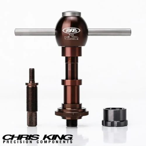 A picture showing a Chris King R45 Bicycle hub service tool in brown and black with brushed chrome handles and top cap.