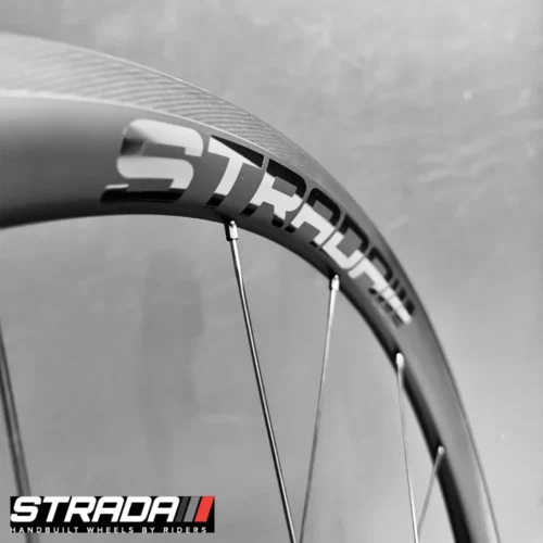 A picture showing a close up view of a the Strada Performance Aero Rim brake 35 Ultra carbon front bicycle rim.